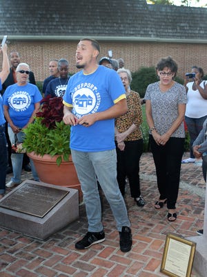 The Rev. Aaron Appling of Victory Church in Dover speaks to the crowd gathered at a September vigil to remember the three homeless men who died in summer and fall 2016. Appling then led the homelessness advocates into City Hall to speak at the open forum before a Dover City Council meeting.