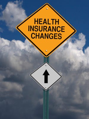 health insurance changes ahead roadsign