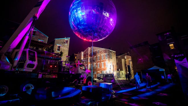 The world's largest mobile disco ball spins on Pleasant Street near Findlay Market. It hails from Louisville, Kentucky.