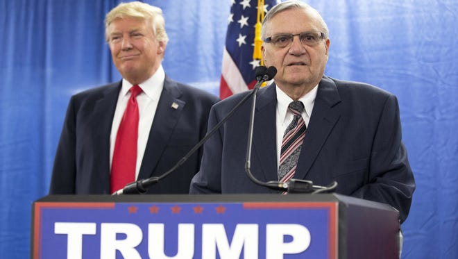 FILE - In this Jan. 26, 2016, file photo, then-Republican presidential candidate Donald Trump was joined by Joe Arpaio, the sheriff of metro Phoenix, during a news conference in Marshalltown, Iowa. owing his recent conviction in federal court. Fresh off his presidential pardon, an emboldened Arpaio on Monday, Aug. 28, 2017, lashed out at his critics and the judge who found him guilty of a crime as his attorneys went to court to throw the court decision that was the basis for his conviction. (AP Photo/Mary Altaffer, File)