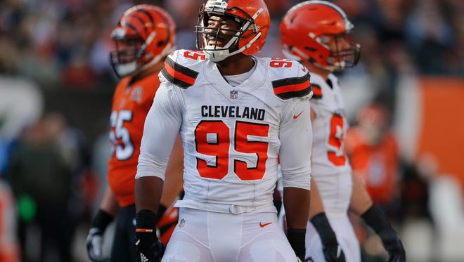 Cleveland Browns defensive end Myles Garrett (95) celebrates after sacking Cincinnati Bengals quarterback Andy Dalton on Nov. 26, 2017, in Cincinnati.
