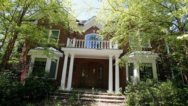 The former home of ex- basketball player Latrell Sprewell which in is the middle of a long foreclosure at 4340 Purchase Street in Harrison is shown on June 16.