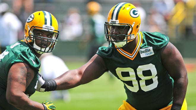 Green Bay Packers defensive end Carlos Gray, left, and defensive tackle Letroy Guion during OTA practice at Ray Nitschke Field.
