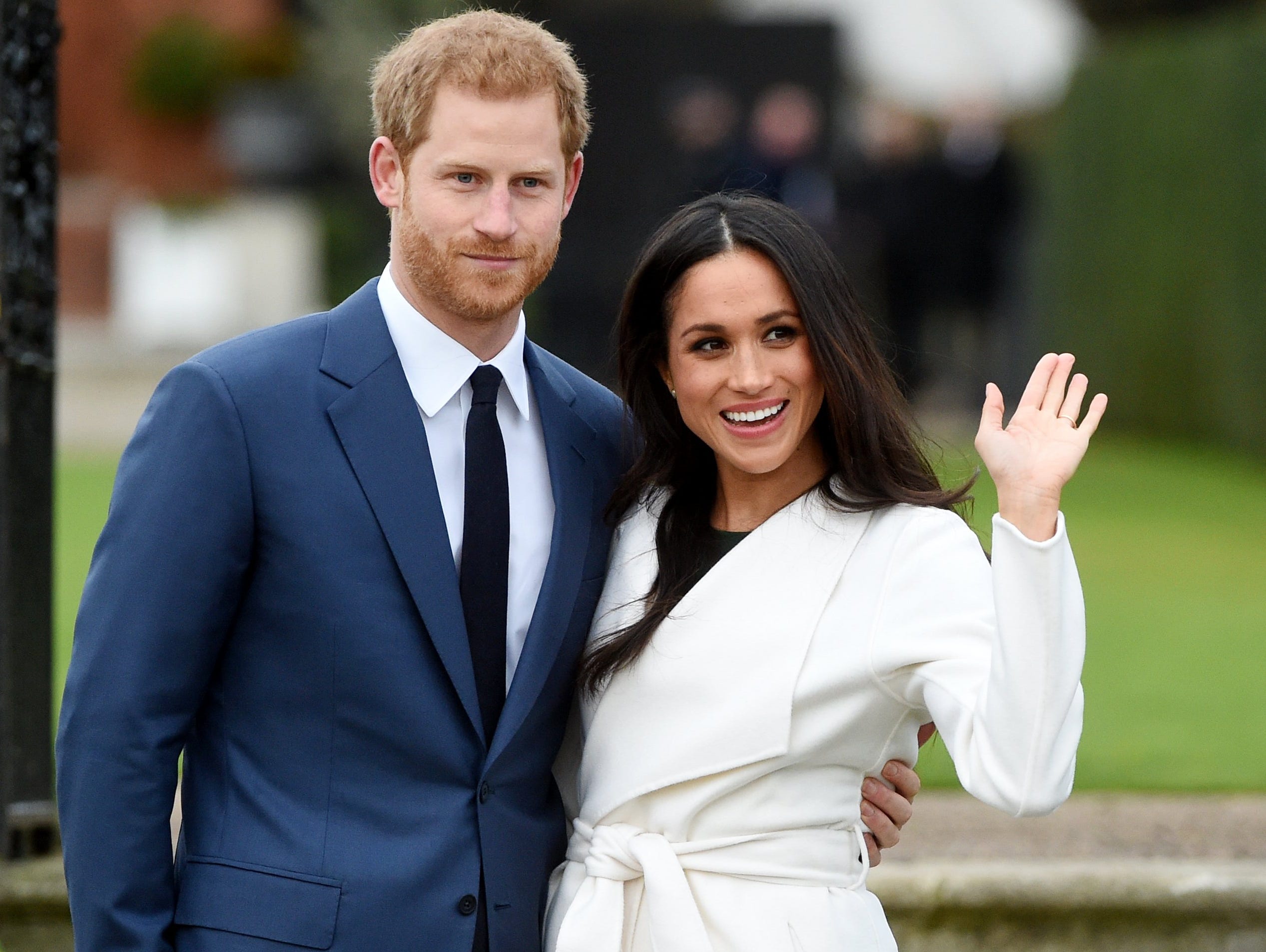 Britain's Prince Harry pose with Meghan Markle during a photocall after announcing their engagement in the Sunken Garden in Kensington Palace in London.