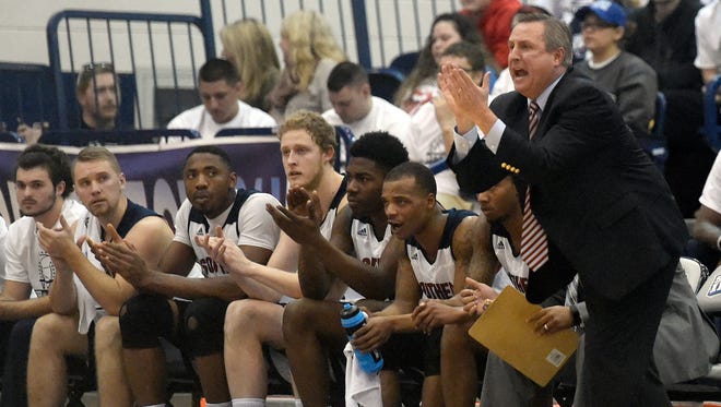 USI coach Rodney Watson applauds his teams effort against Wisconsin-Parkside at the PAC in Evansville Thursday.
