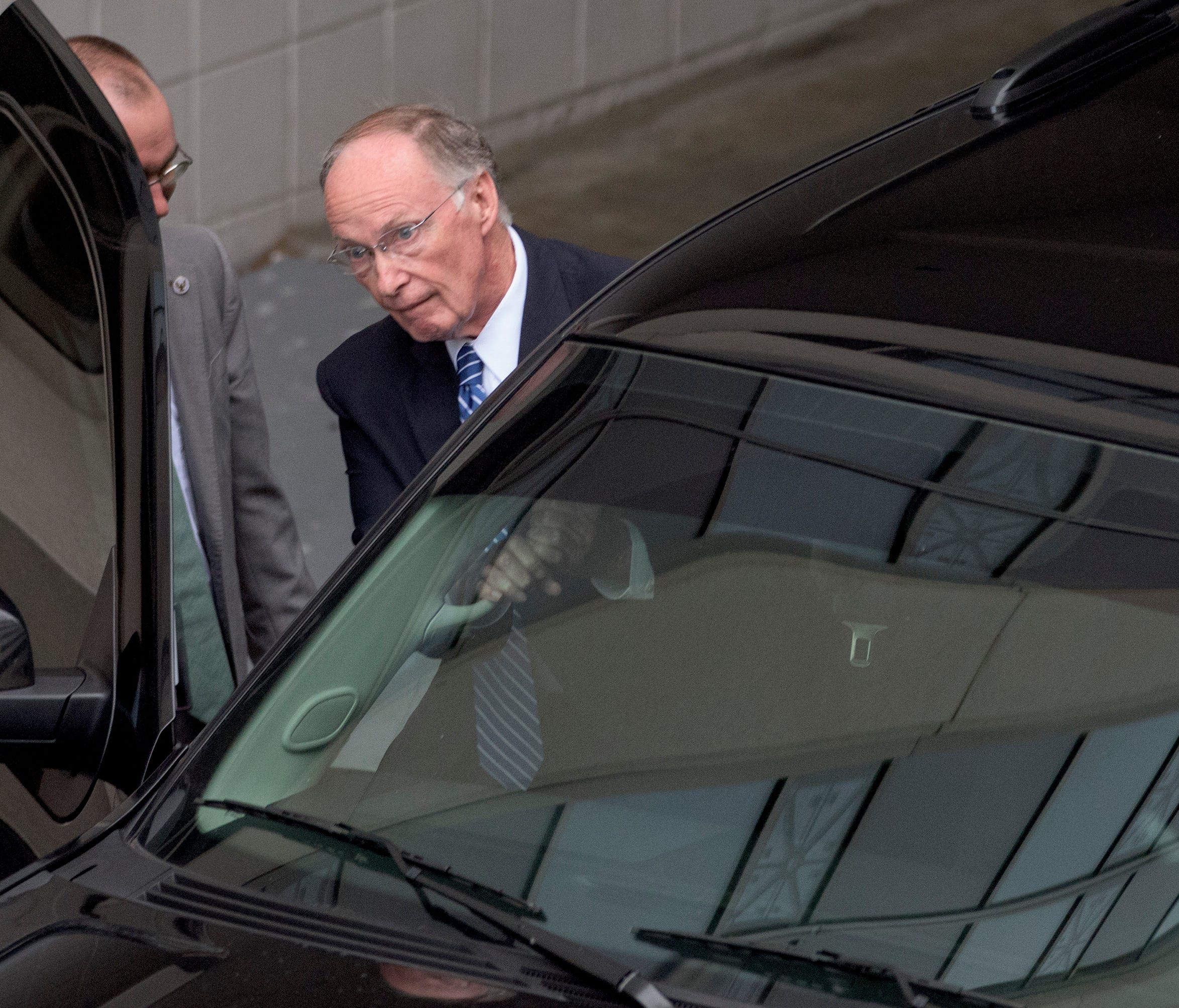Alabama Governor Robert Bentley exits out of the back of the RSA Union Building in Montgomery, Ala., on Wednesday April 5, 2017 as the Alabama Ethics Commission meets in executive session looking into allegations against him.