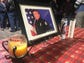Paul Lazinsky's photo is surrounded by candles at the
