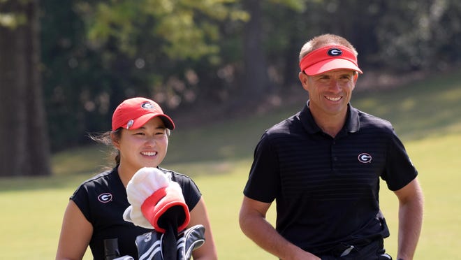 FILE PHOTO - UGA's Rinko Mitsunaga and Georgia head coach Josh Brewer during the first round of the 46th annual Liz Murphey Collegiate Classic on the University of Georgia Golf Course in Athens.