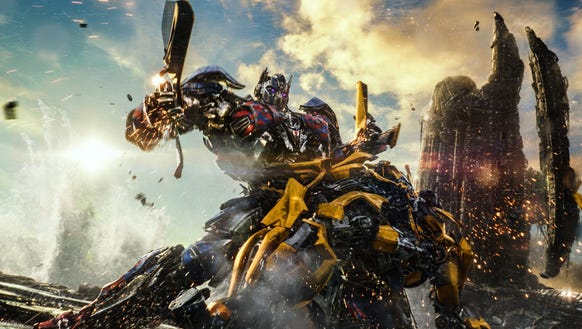 Autobot pals Optimus Prime and Bumblebee tussle in