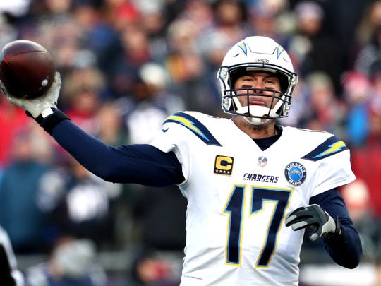 FOXBOROUGH, MASSACHUSETTS - JANUARY 13: Philip Rivers #17 of the Los Angeles Chargers throws during the third quarter in the AFC Divisional Playoff Game against the New England Patriots at Gillette Stadium on January 13, 2019 in Foxborough, Massachusetts. (Photo by Al Bello/Getty Images)