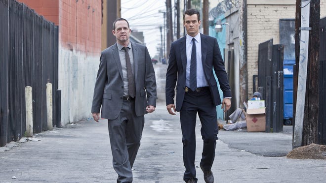 Josh Duhamel, right, and Dean Winters starred in “Battle Creek” on CBS. The show’s cancellation was reported Friday.