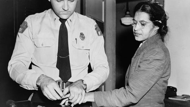 Rosa Parks is fingerprinted after being arrested on Dec. 1, 1955, for refusing to give up her bus seat to a white man.