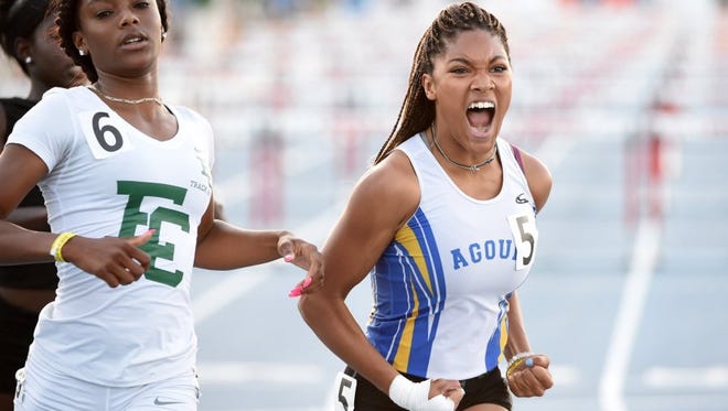 Agoura's Tara Davis celebrates after winning the 100-meter hurdles title during the state track and field championships in Clovis last year. Davis won two state titles last year and could be a threat to win three this year.