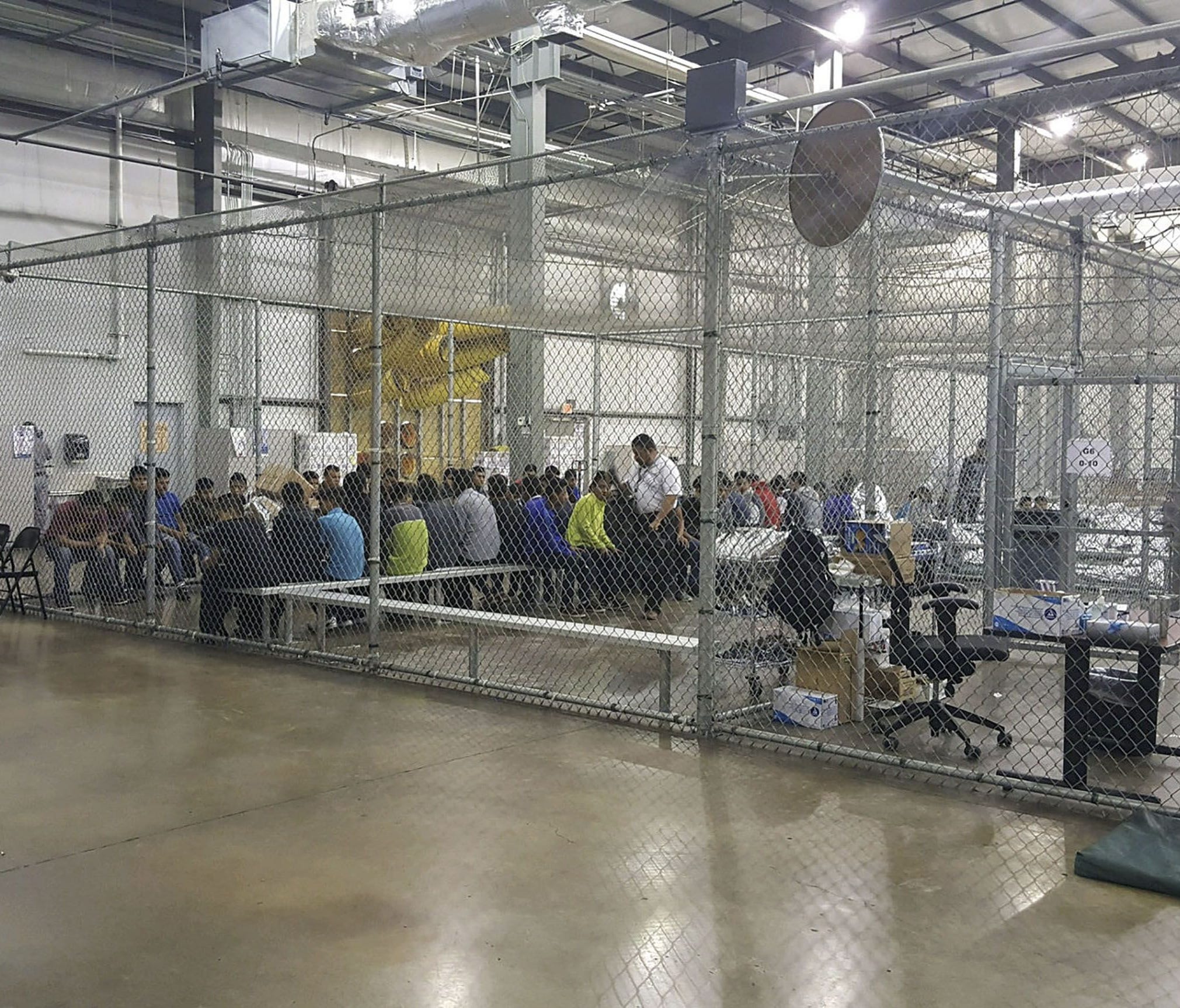 This US Customs and Border Protection photo dated June 17, 2018, and obtained June 18, 2018, shows intake of illegal border crossers by US Border Patrol agents at the Central Processing Center in McAllen, Texas.