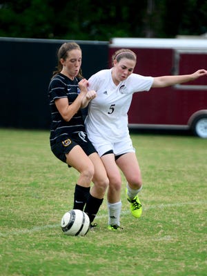 Westview's Naomi Griffin and Sacred Heart's Hannah Fitzgerald battle for posession of the ball on Tuesday.