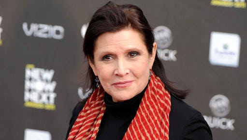 FILE - This April 7, 2011 file photo shows Carrie Fisher at the 2011 NewNowNext Awards in Los Angeles. Lucasfilm, the company behind “Star Wars,” says there are no plans to digitally recreate the late Carrie Fisher to play Princess Leia in future episodes of the movie saga. The Disney-owned Lucasfilm made the rare foray into the world of “Star Wars” speculation Friday, Jan. 13, 2017 by issuing the statement denying any plans to digitize Fisher, who died Dec. 27. (AP Photo/Chris Pizzello, File)