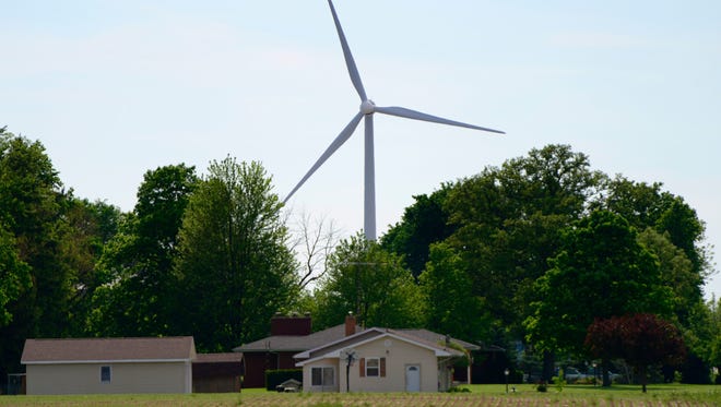 Wind turbines churning in Findlay. More than 80 turbines have been proposed by APEX Clean Energy in Sandusky and Seneca counties. Rep. Bill Reineke came out Wednesday in favor of existing state law regarding wind turbine setback requirements.