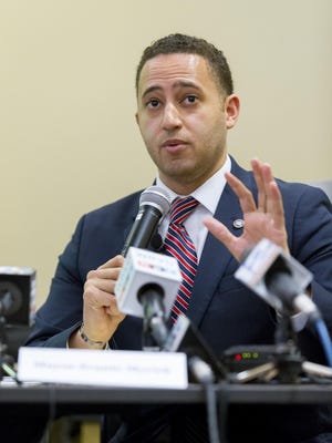 Ithaca Mayor Svante Myrick answers a question Wednesday morning during a news conference to announce a comprehensive plan to fight heroin and drug addiction in the city.