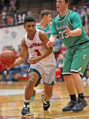 Park Tudor's #3 Isiah Moore, left, moves past Cloverdale's #33 Seth Pfaff during the Cloverdale vs Park Tudor basketball game of the Tip Off Classic at Southport Fieldhouse, Saturday, December 10, 2016.  Park Tudor won the game 74-63.