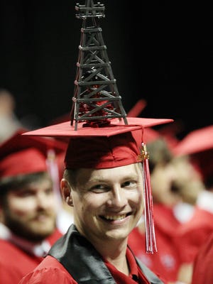 UL petroleum engineering major Stephen Schafer wears an oil derrick on his mortarboard during UL's 2014 Spring Commencement. UL petroleum engineering major Stephen Schafer wears an oil derrick on his mortarboard during UL's 2014 Spring Commencement General Assembly Saturday, May 17, 2014, at the Cajundome in Lafayette, La.