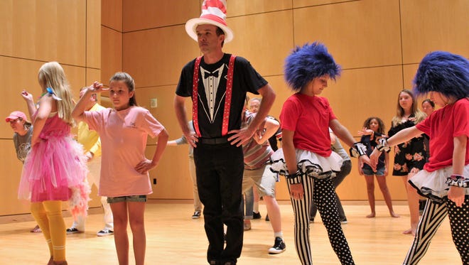 The Cat in the Hat (Keith May) leads the way in rehearsal of this dance scene from "Seussical," which opens Aug. 10 at the Naoma Huff Performing Arts Center in Clyde.
