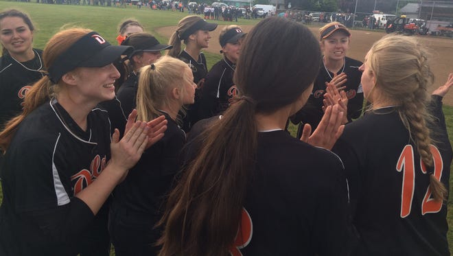 The Dallas softball team celebrates beating Silverton on Tuesday to reach the OSAA Class 5A state championship game.