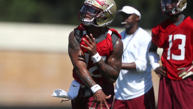 FSU's Deondre Francois throws the ball during their opening practice for fall camp at the Al Dunlap Training Facility Monday, Aug. 6, 2018. 