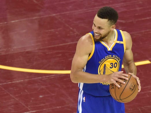 Stephen Curry smiles during the fourth quarter of Game