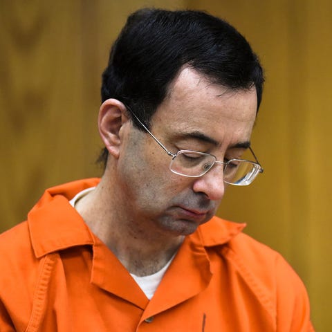 Larry Nassar looks down Monday, Feb. 5, 2018, on t