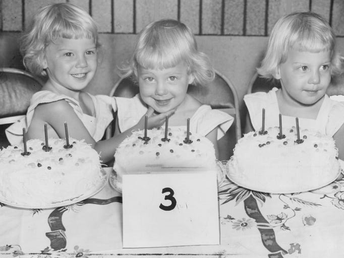 The Drabinski triplets, Monica, Marlene and Mary, pose