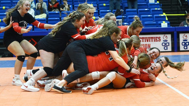 The Mansfield volleyball team rushes the floor after they won the 2A state championship in the Hot Springs Convention Center on Saturday, Oct. 31. Mansfield defeated Lavaca 3-0.