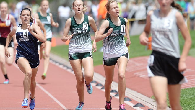 Heritage Christian's Rebekah Rairdon, left, and Rachel Rairdon compete in the 1A 800 meter run at the state track and field meet at Jeffco Stadium on Friday.