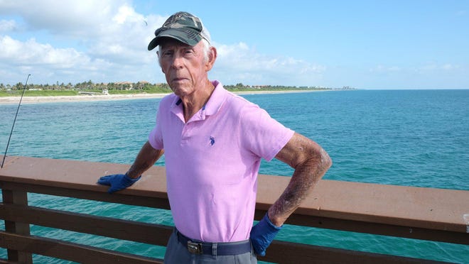 Bill Conklin stands on the Juno Beach Pier.