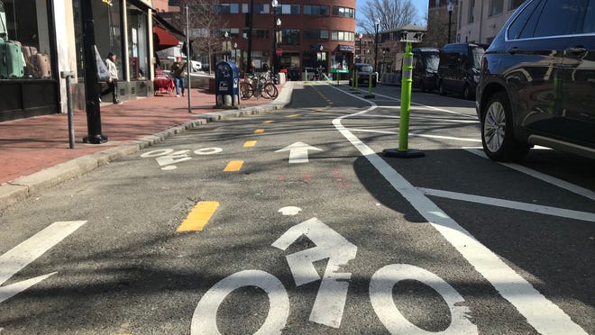 The updated Cycling Safety Ordinance, passed on Oct. 5, sets a May 1, 2026, deadline for Cambridge's 22.6-mile network of protected bike lanes to be installed using either permanent construction or quick-build approaches.