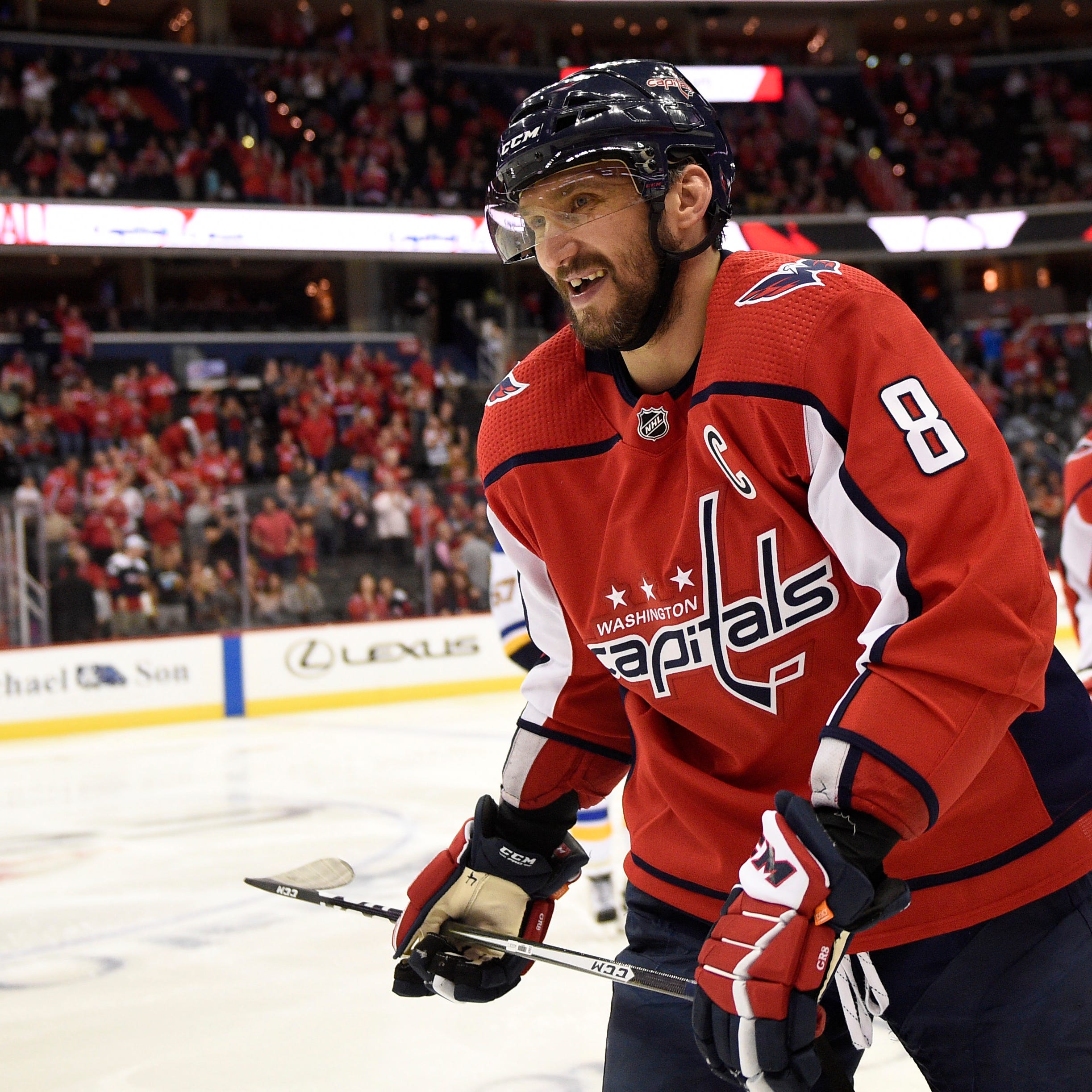Washington Capitals left wing Alex Ovechkin (8), of Russia, reacts as he skates towards bench after he scored a goal during the third period of an NHL preseason hockey game against the St. Louis Blues, Sunday, Sept. 30, 2018, in Washington. The Capit