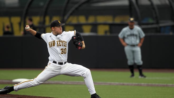 Iowa's Nick Gallagher delivers a pitch during the Hawkeyes' game against Purdue at Duane Banks Field on Friday, March 24, 2017.