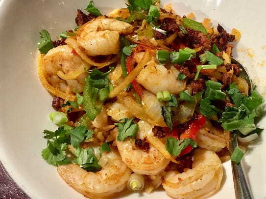 Mexican paella with shrimp on the menu at Cicada Cantina.