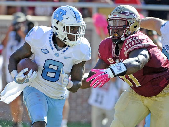 North Carolina RB T.J. Logan (8), was drafted by the