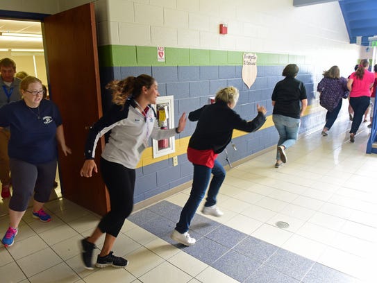 Fayetteville Elementary School faculty members evacuate