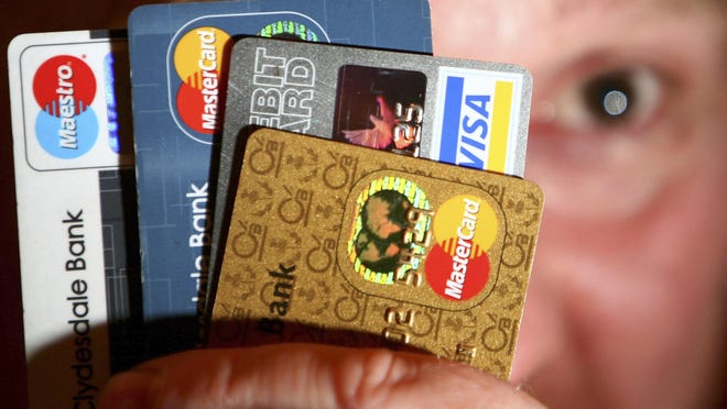 Credit card debt tumbled, as consumers paid down high-cost credit card debt and cut back on big vacation spending and other purchases for much of the past year.