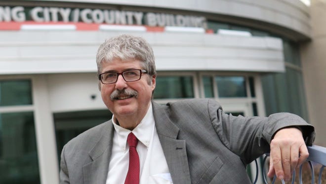 John Flaherty, a board member for the Delaware Coalition for Open Government, in front of the Louis L. Redding City/County Building.
