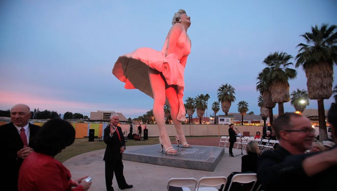 Red lights flood the "Forever Marilyn" statue in downtown Palm Springs in January 2014.