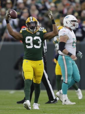 Green Bay Packers linebacker Reggie Gilbert (93) celebrates recovering a fumble in the first quarter against Miami Sunday, November 11, 2018, Lambeau Field in Green Bay, Wis.