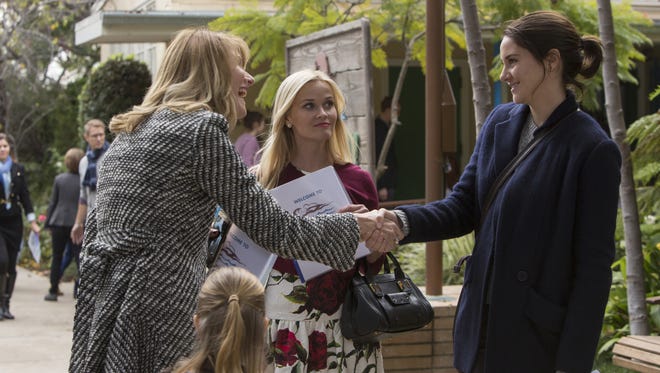 Businesswoman Renata (Laura Dern), left, meets Monterey newcomer Jane (Shailene Woodley), right, as Madeline (Reese Witherspoon) looks on in HBO's 'Big Little Lies.'