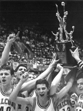 1989: Council Bluffs St. Albert players celebrate their Class 2-A championship.