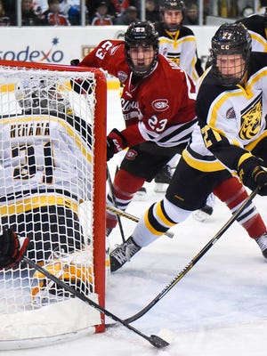 St. Cloud State's Robby Jackson (23) approaches the goal between Colorado College goalie Jacob Nehama (31) and Ben Israel (27) on Jan. 8 at the Herb Brooks National Hockey Center.