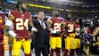 Washington Redskins owner Daniel Snyder stands with
