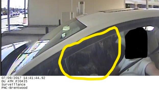 Wyoming police distributed this image from a robbery that occurred Sunday. Police said three men forced the driver to drive to ATMS and withdraw cash.