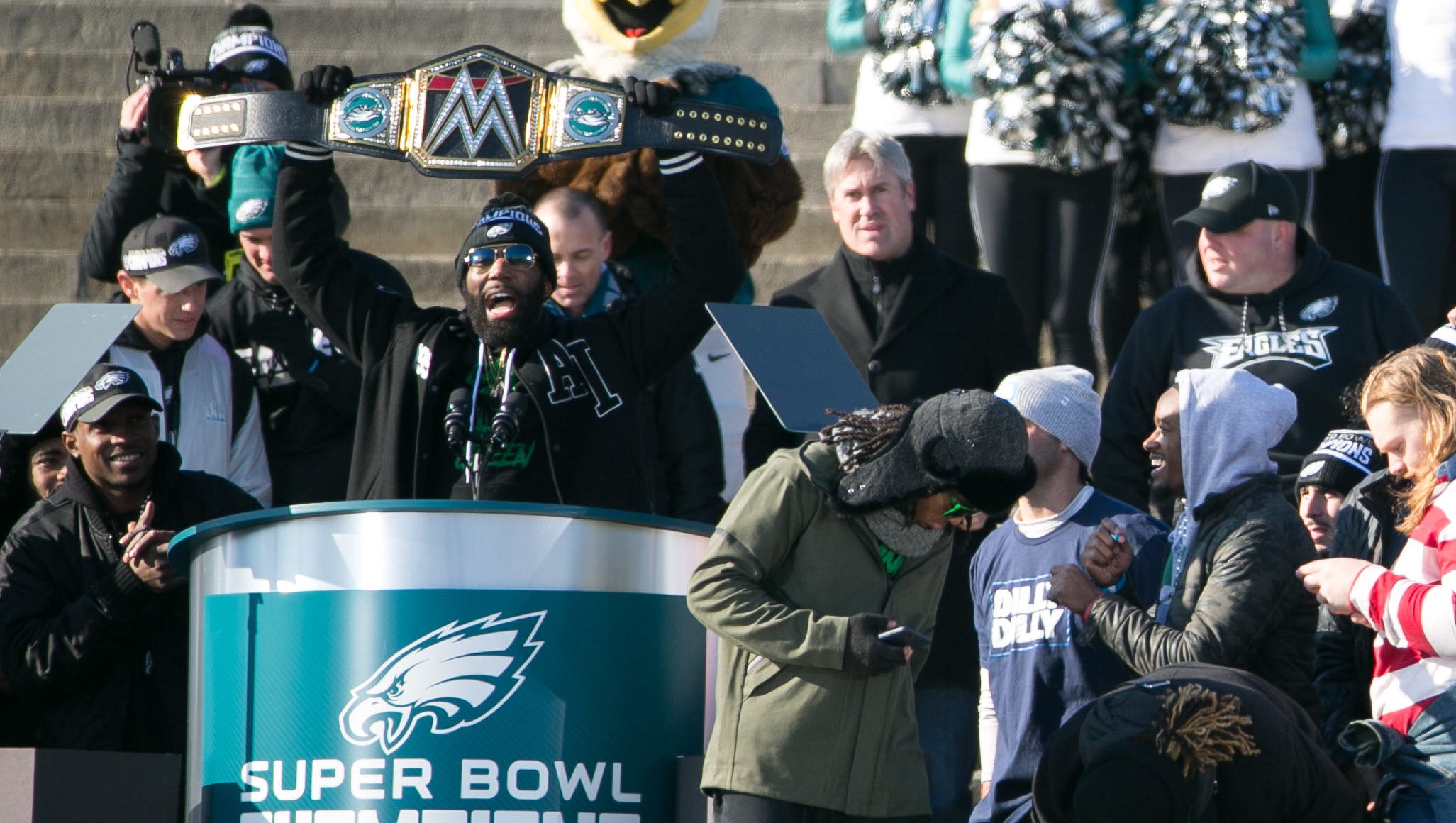 Safety Malcolm Jenkins holds up a championship belt during the Eagles' Super Bowl parade.