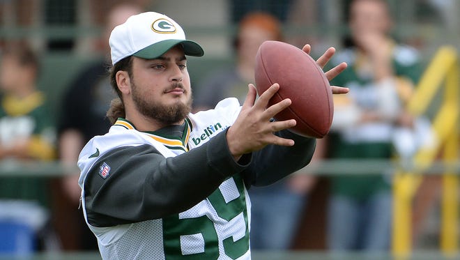 Injured offensive lineman David Bakhtiari (69) made an appearance at Green Bay Packers Training Camp at Ray Nitschke Field August 26, 2015.